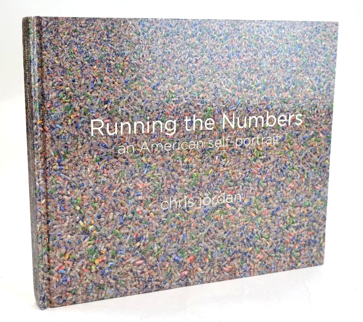 Cover of RUNNING THE NUMBERS AN AMERICAN SELF-PORTRAIT by Chris Jordan; Chris Bruce; Lucy R. Lippard; Paul Hawken
