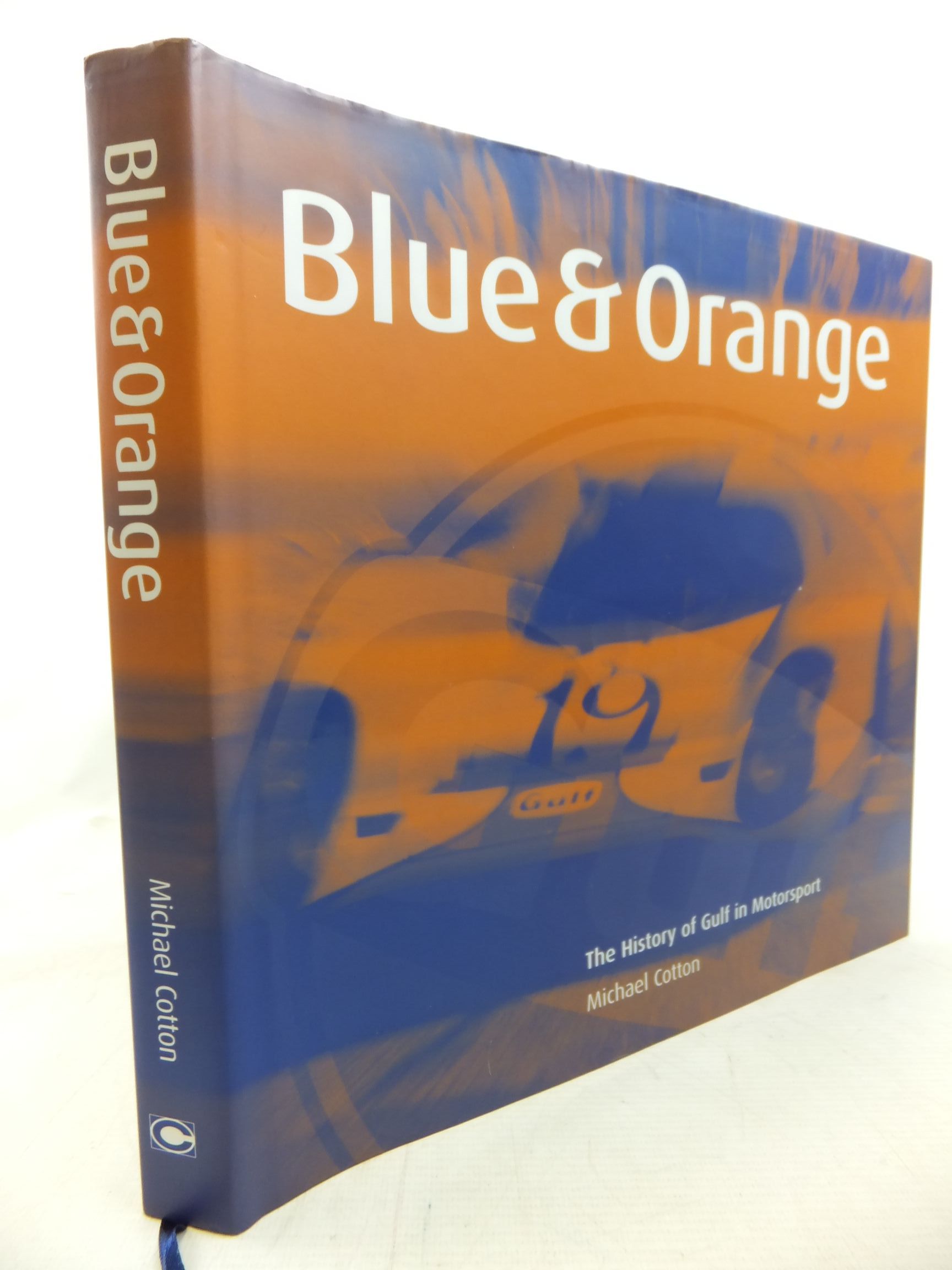 Cover of BLUE &amp; ORANGE: THE HISTORY OF GULF IN MOTORSPORT by Michael Cotton