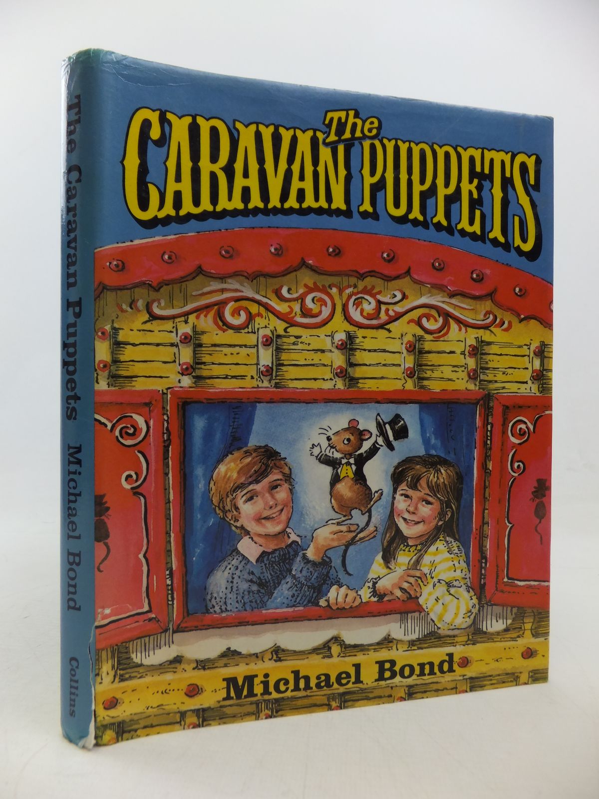 Photo of THE CARAVAN PUPPETS written by Bond, Michael illustrated by Julian-Ottie, Vanessa published by Collins (STOCK CODE: 2113109)  for sale by Stella & Rose's Books